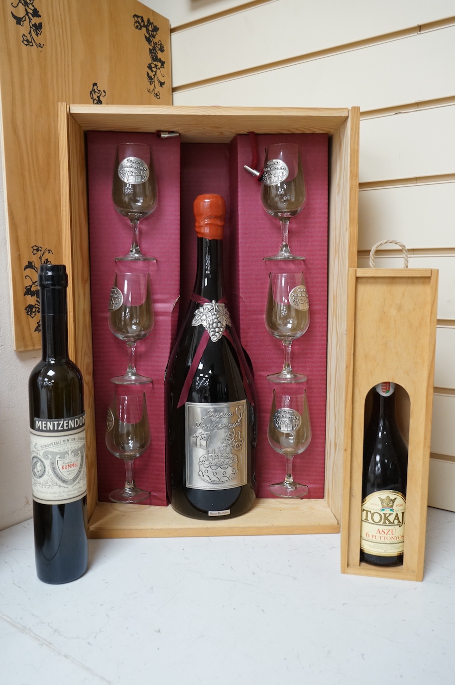 One bottle of Kummel, another, Tokaji, and a Joyeux Anniversaire, cased